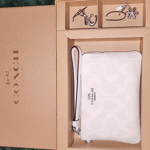 White Coach Wristlet with Charms